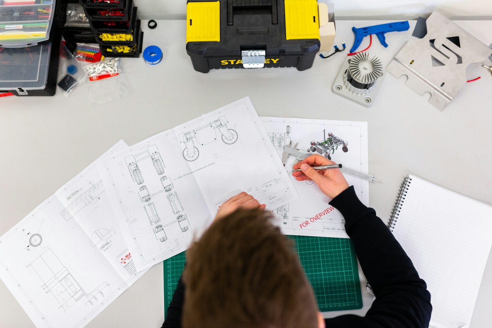 Industrial technician at equipment — petrochemical wastewater treatment context. Photo via Unsplash.