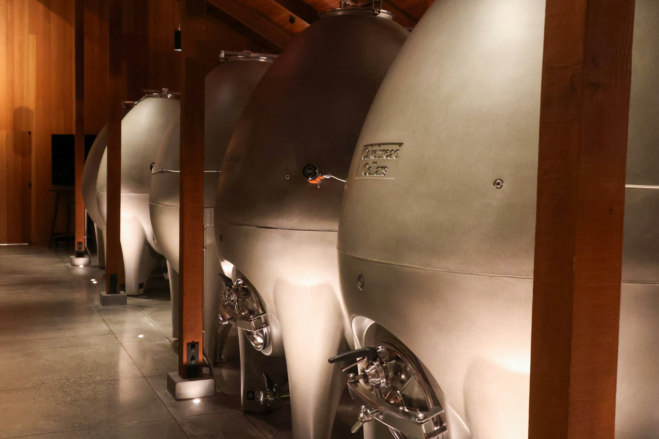 Distillery production with copper stills and casks — spent wash and evaporation context. Photo: Meg von Haartman on Unsplash.